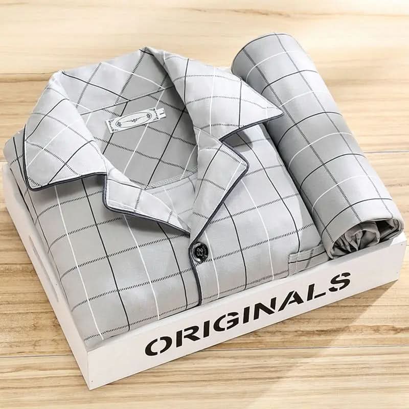 Men's pajama set featuring a button-down shirt and matching pants, designed for year-round comfort with soft, breathable fabric, ideal for restful sleep. 5