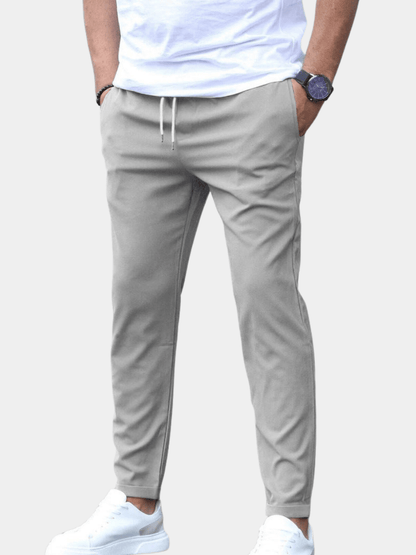Men's pants featuring an elastic waistband for enhanced comfort, designed for modern everyday wear with a stylish and versatile look. 1