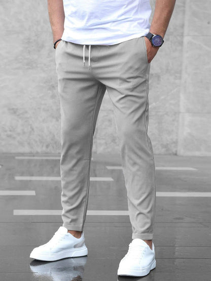 Men's pants featuring an elastic waistband for enhanced comfort, designed for modern everyday wear with a stylish and versatile look. 0
