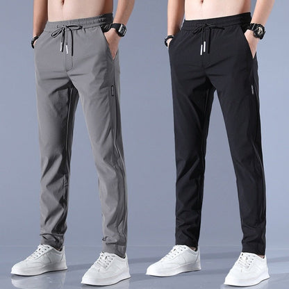 Men's quick-dry stretch trousers with drawstring, designed for comfort and flexibility in outdoor activities, featuring soft activewear fabric for optimal performance. 1