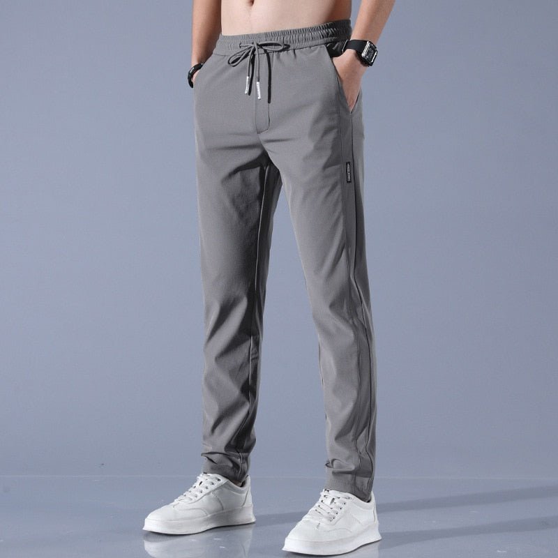 Men's quick-dry stretch trousers with drawstring, designed for comfort and flexibility in outdoor activities, featuring soft activewear fabric for optimal performance. 2