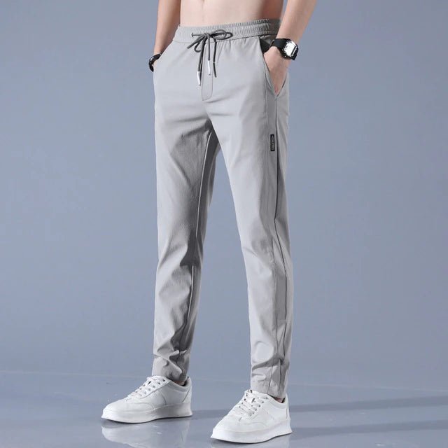 Men's quick-dry stretch trousers with drawstring, designed for comfort and flexibility in outdoor activities, featuring soft activewear fabric for optimal performance. 4