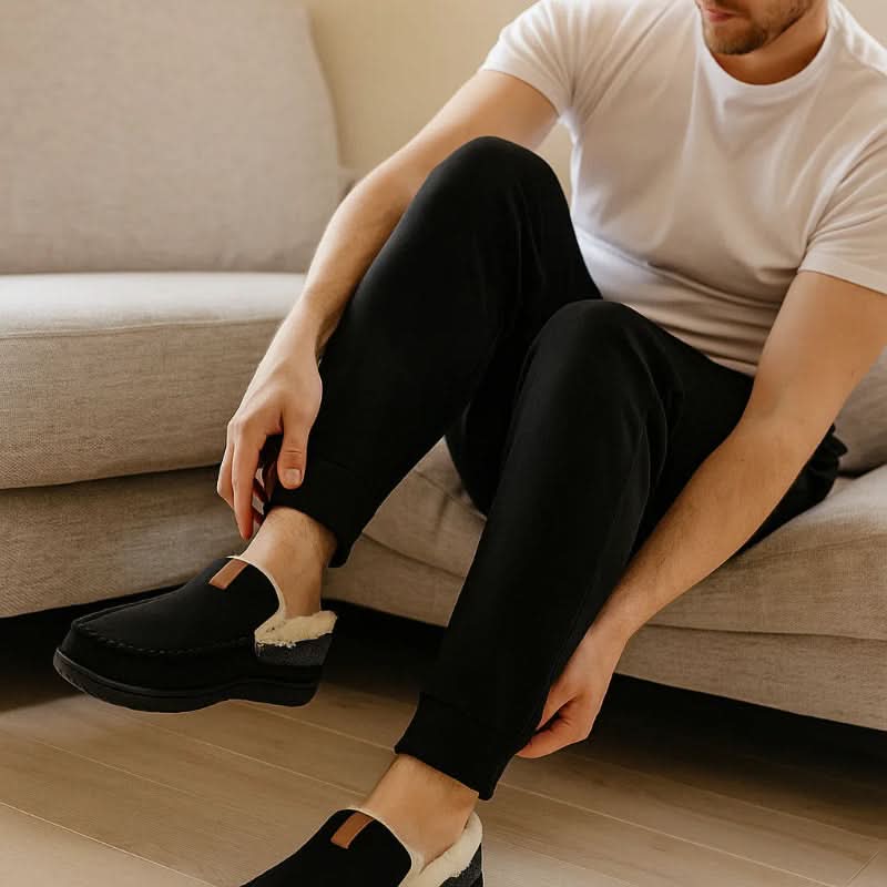 Men's slippers featuring a classic loafer design made with warm synthetic wool, perfect for winter comfort and relaxation. 2