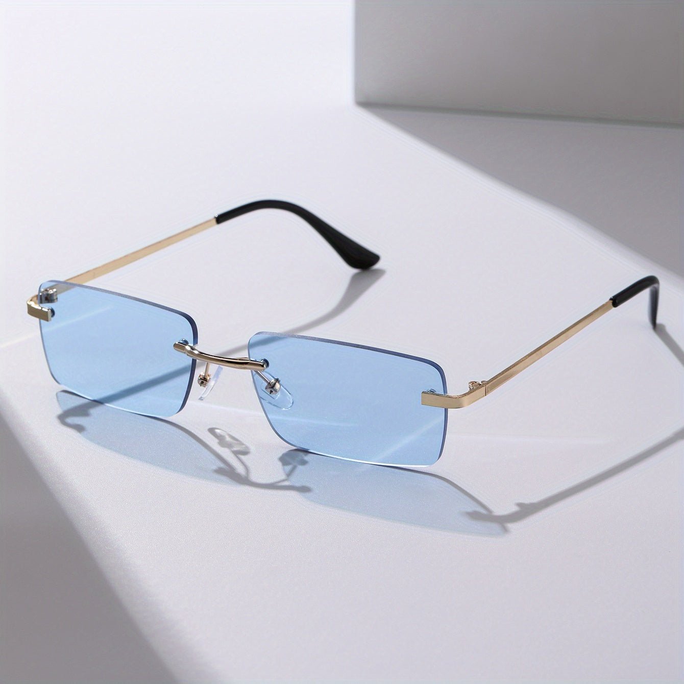 Men's sunglasses featuring a lightweight metal frame and frameless design, providing UV protection for stylish and comfortable outdoor wear. 4