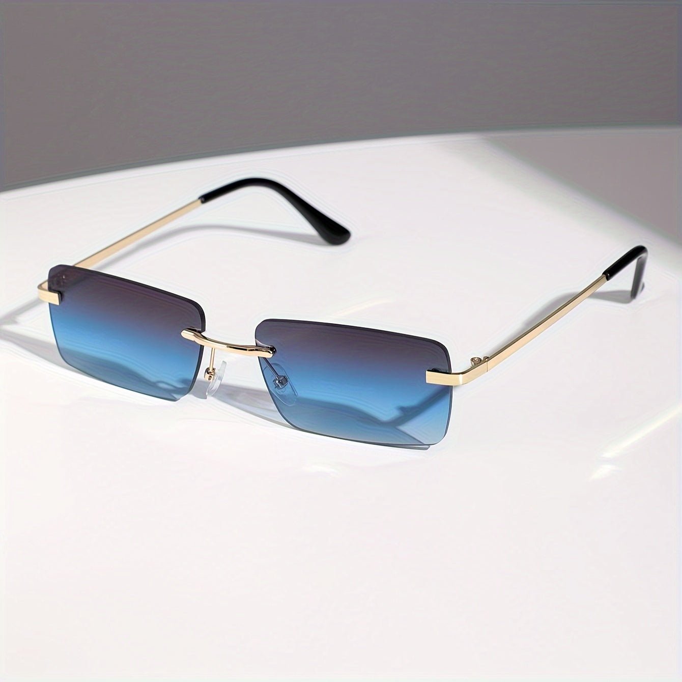 Men's sunglasses featuring a lightweight metal frame and frameless design, providing UV protection for stylish and comfortable outdoor wear. 1