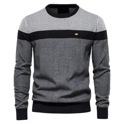 Men's blue sweater made from soft-knit fabric, featuring a classic elegant design for comfortable warmth and style. 1