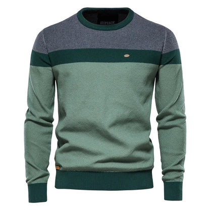 Men's blue sweater made from soft-knit fabric, featuring a classic elegant design for comfortable warmth and style. 2