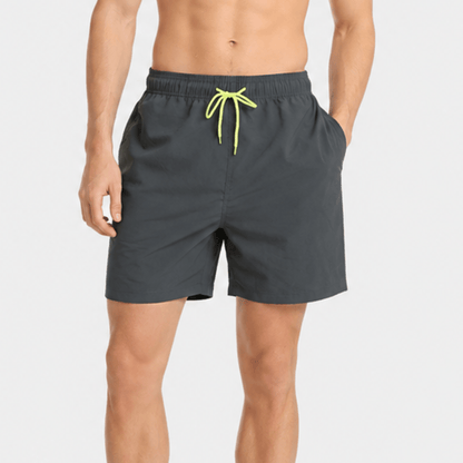 Men's swim shorts featuring quick-drying fabric, adjustable waistband, and athletic fit, designed for comfort and style above the knee. 15