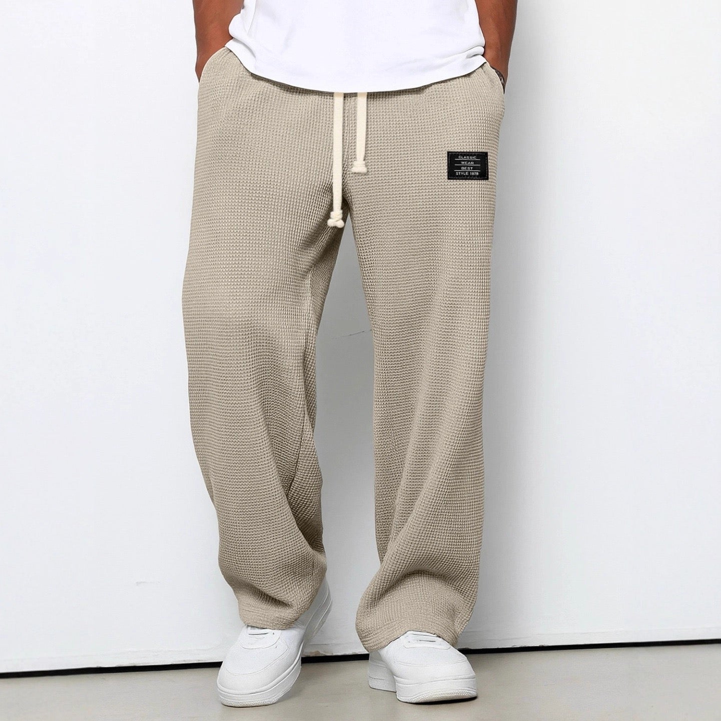 Men's trousers featuring an adjustable waistband and relaxed fit, made from breathable lightweight fabric, perfect for casual and smart wear. 4