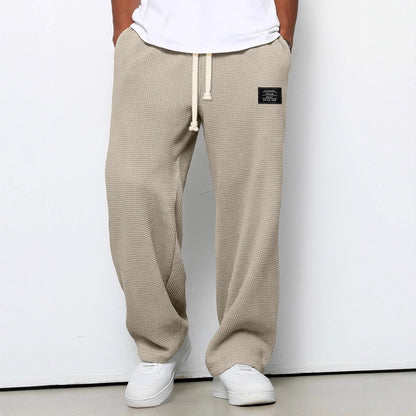 Men's trousers featuring an adjustable waistband and relaxed fit, made from breathable lightweight fabric, perfect for casual and smart wear. 4