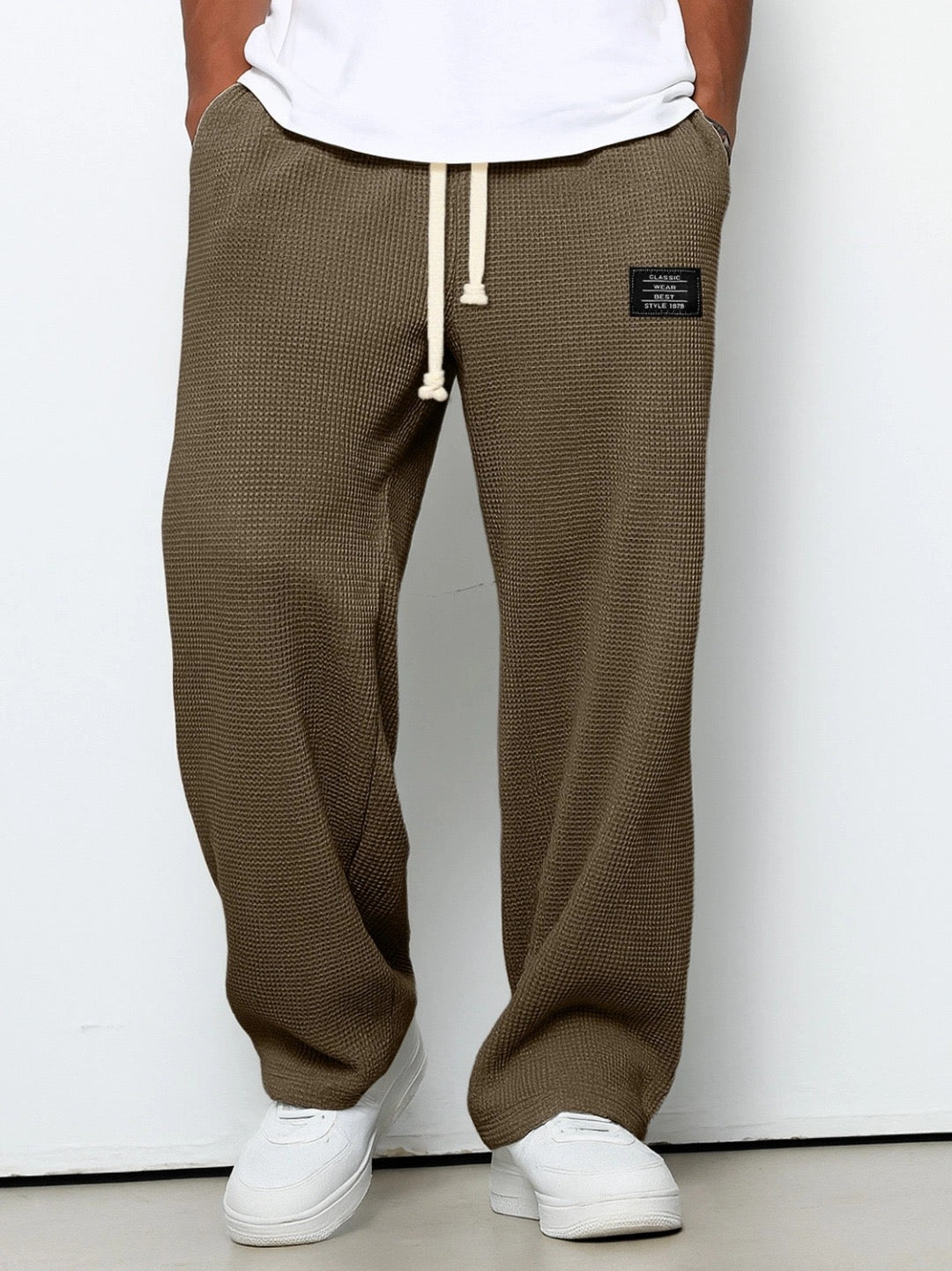 Men's trousers featuring an adjustable waistband and relaxed fit, made from breathable lightweight fabric, perfect for casual and smart wear. 8