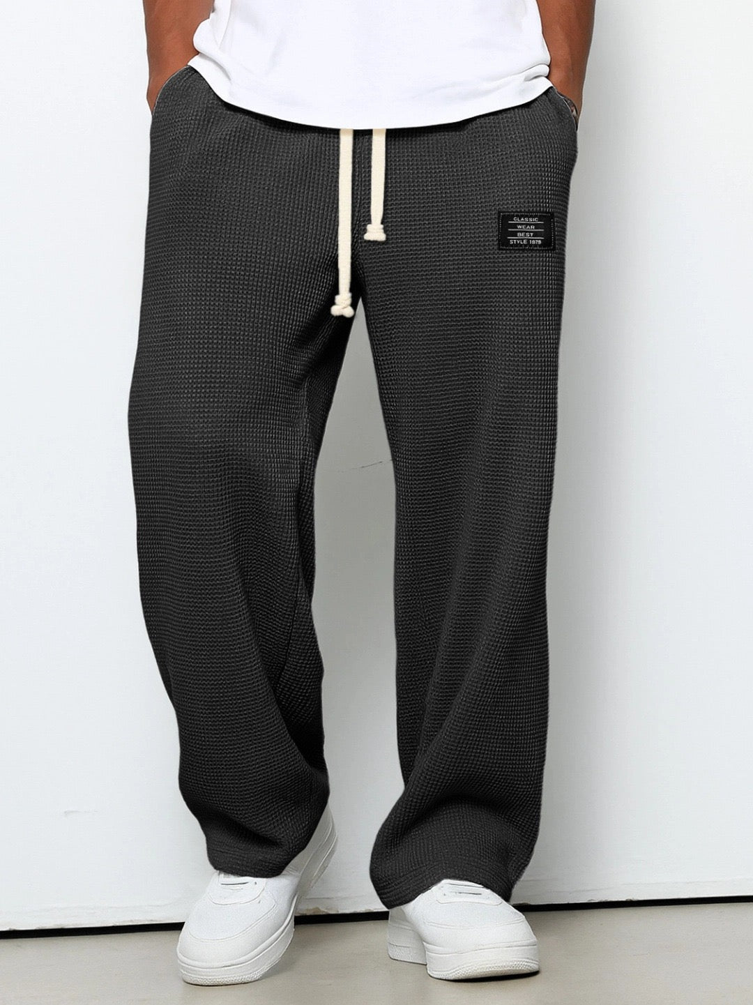 Men's trousers featuring an adjustable waistband and relaxed fit, made from breathable lightweight fabric, perfect for casual and smart wear. 7