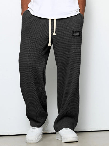 Men's trousers featuring an adjustable waistband and relaxed fit, made from breathable lightweight fabric, perfect for casual and smart wear. 7