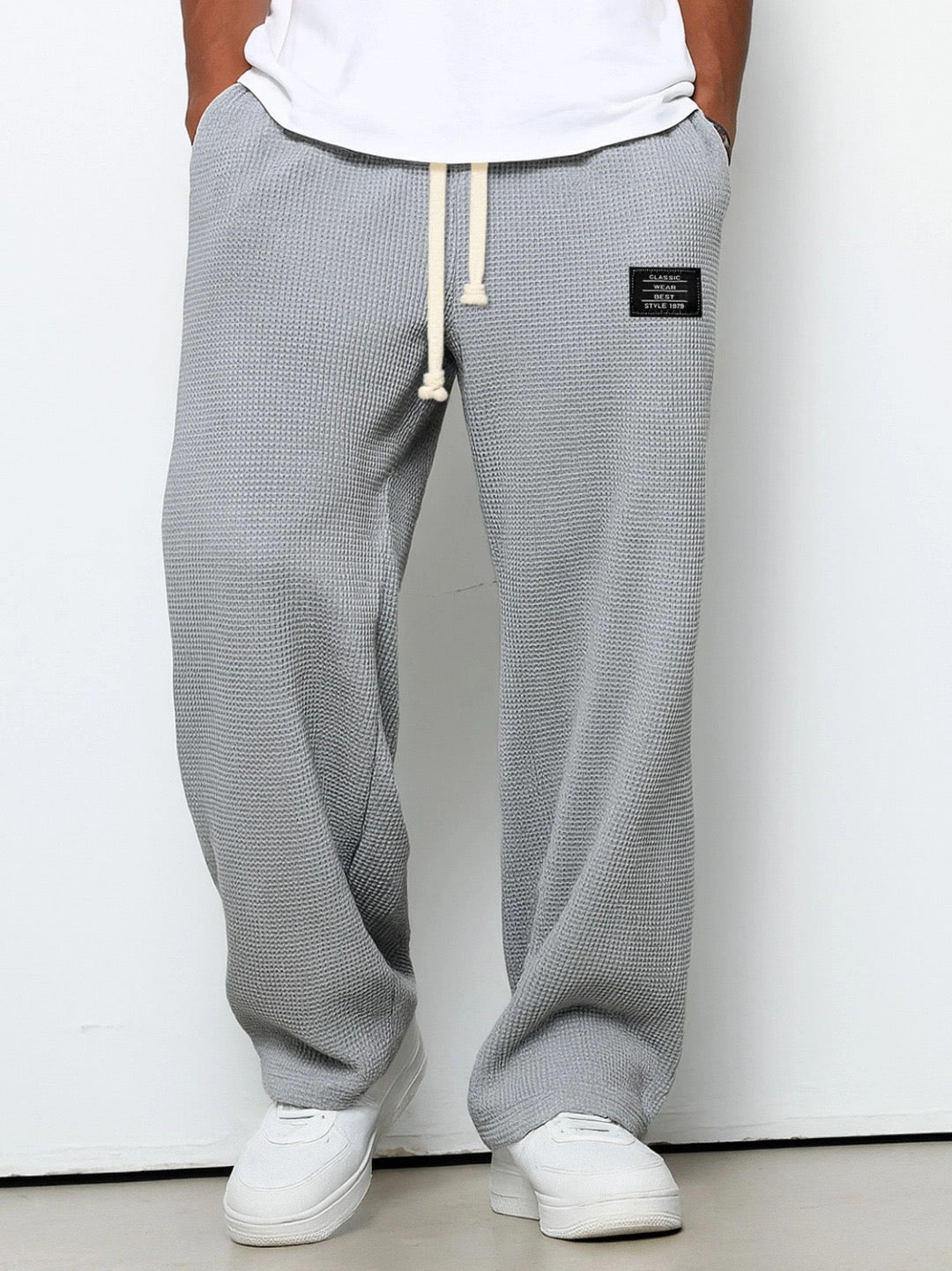 Men's trousers featuring an adjustable waistband and relaxed fit, made from breathable lightweight fabric, perfect for casual and smart wear. 3