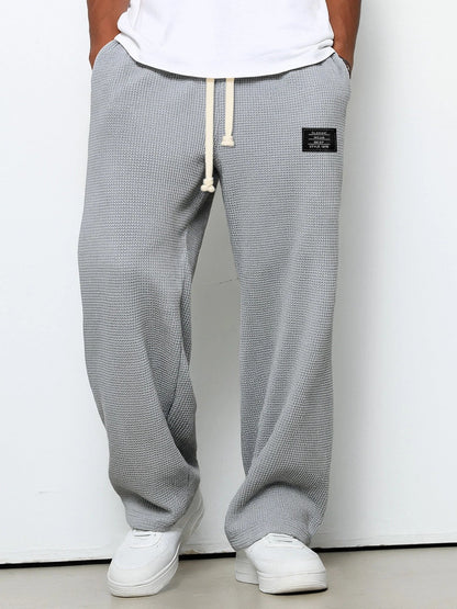 Men's trousers featuring an adjustable waistband and relaxed fit, made from breathable lightweight fabric, perfect for casual and smart wear. 3