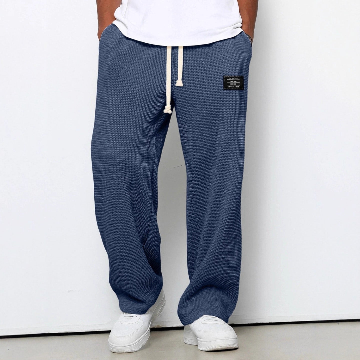 Men's trousers featuring an adjustable waistband and relaxed fit, made from breathable lightweight fabric, perfect for casual and smart wear. 6