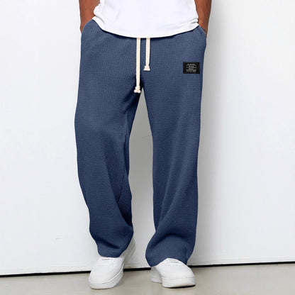 Men's trousers featuring an adjustable waistband and relaxed fit, made from breathable lightweight fabric, perfect for casual and smart wear. 6