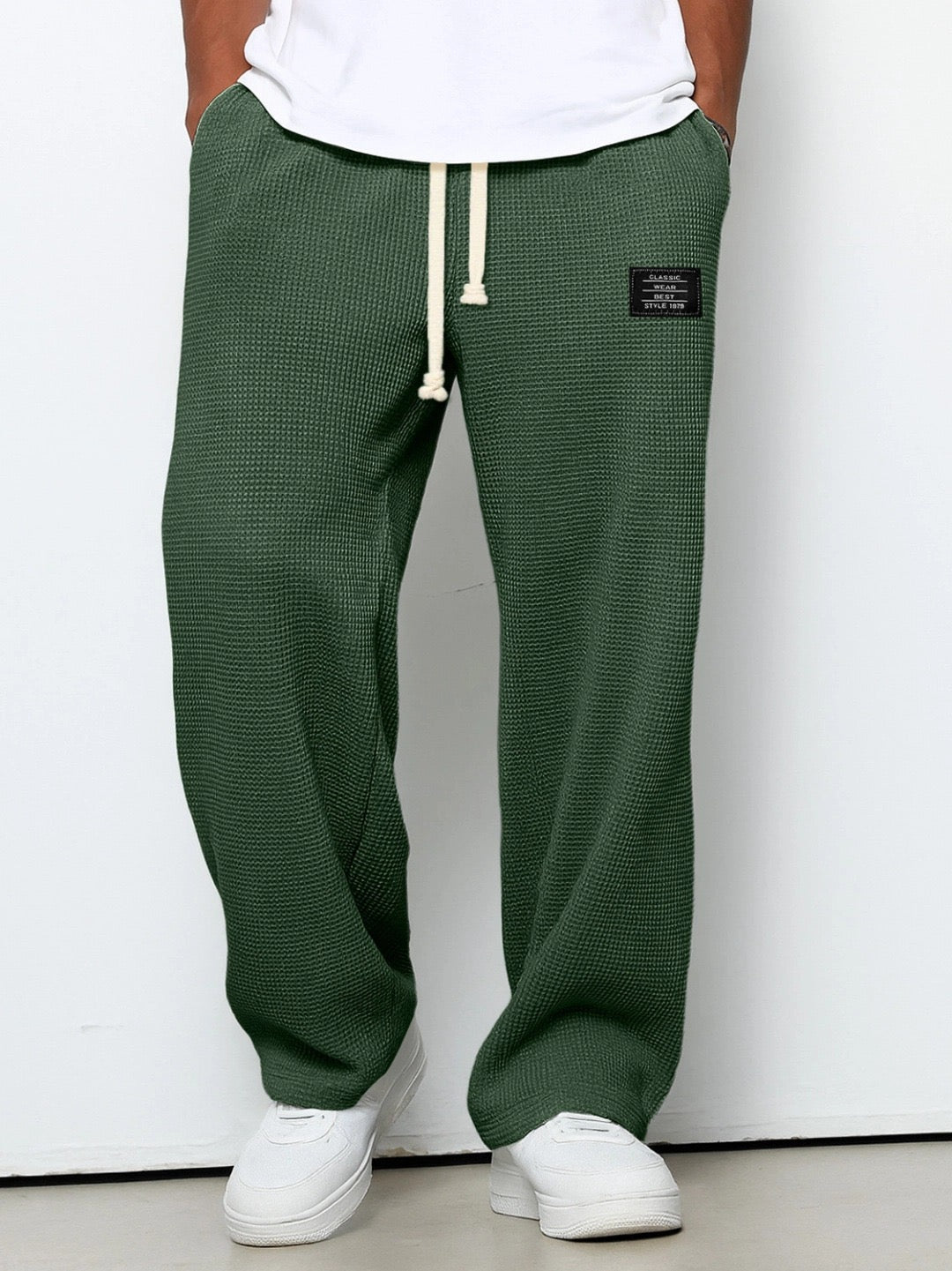 Men's trousers featuring an adjustable waistband and relaxed fit, made from breathable lightweight fabric, perfect for casual and smart wear. 10