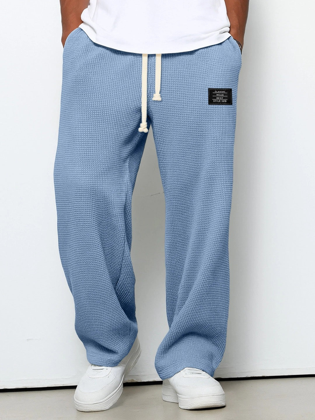 Men's trousers featuring an adjustable waistband and relaxed fit, made from breathable lightweight fabric, perfect for casual and smart wear. 0