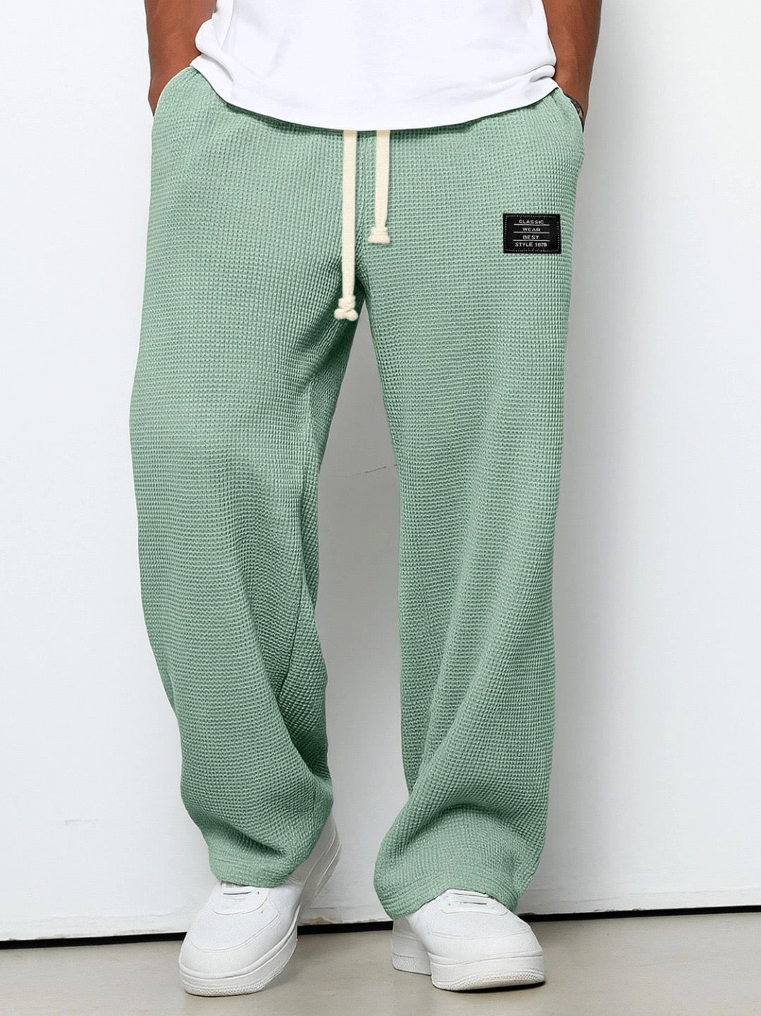 Men's trousers featuring an adjustable waistband and relaxed fit, made from breathable lightweight fabric, perfect for casual and smart wear. 5