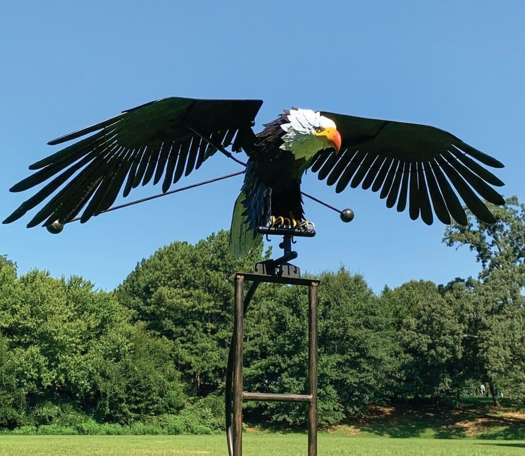 Metal Bird Wind Spinner Garden Ornament featuring moving wings, crafted from weather-resistant metal for durable outdoor decor, ideal for enhancing garden aesthetics. 2