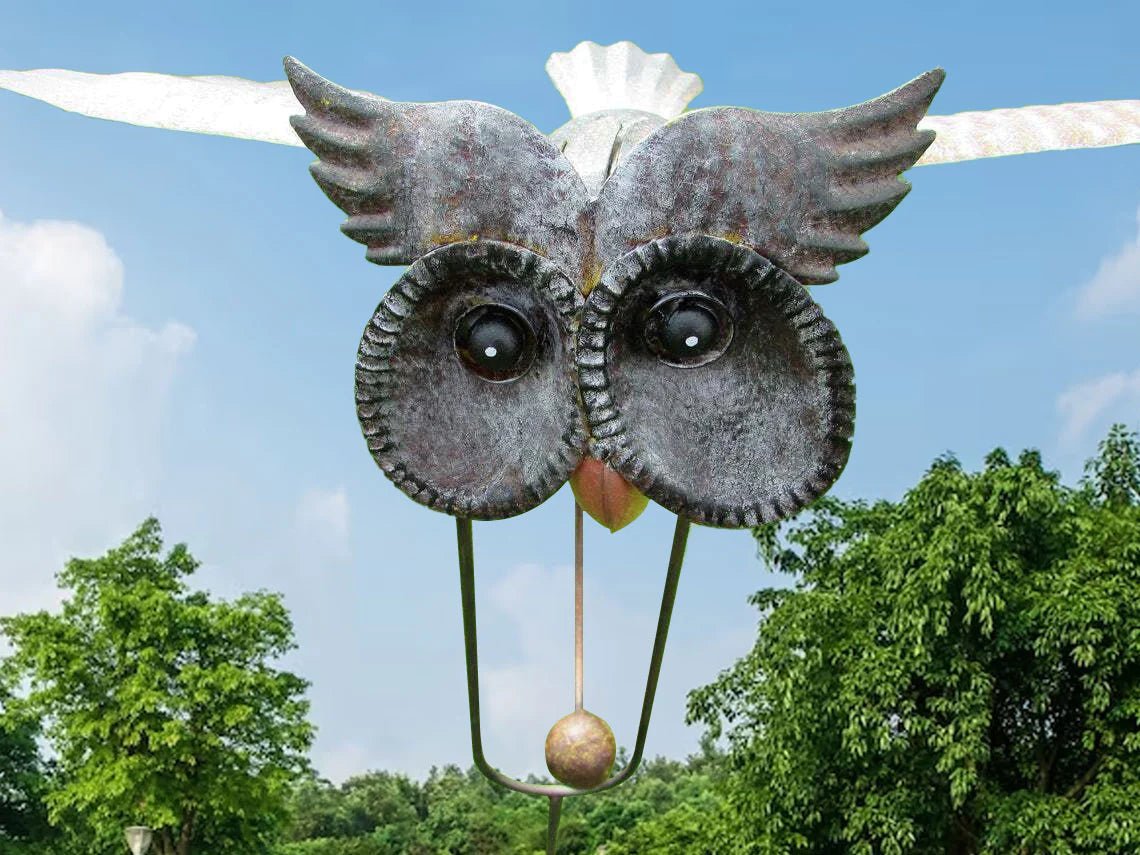 Metal Bird Wind Spinner Garden Ornament featuring moving wings, crafted from weather-resistant metal for durable outdoor decor, ideal for enhancing garden aesthetics. 5