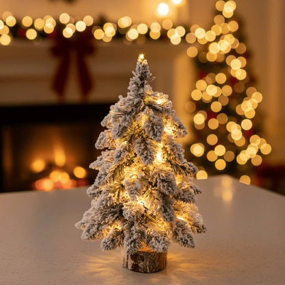 Mini Christmas tree with LED lights and snow effect, 45 cm tall, perfect for compact table decor and holiday decorations. 0