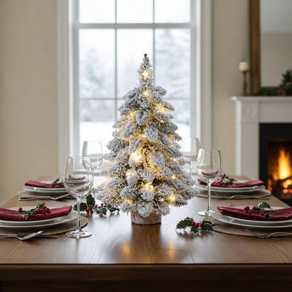 Mini Christmas tree with LED lights and snow effect, 45 cm tall, perfect for compact table decor and holiday decorations. 2