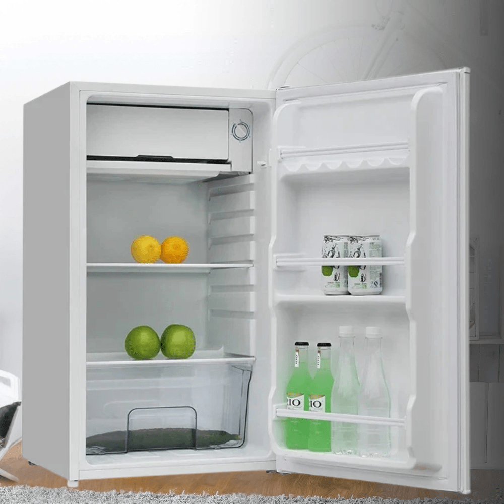 Mini fridge for bedroom with a single door, available in black, white, or red, perfect for storing beverages and snacks in a compact design. 0