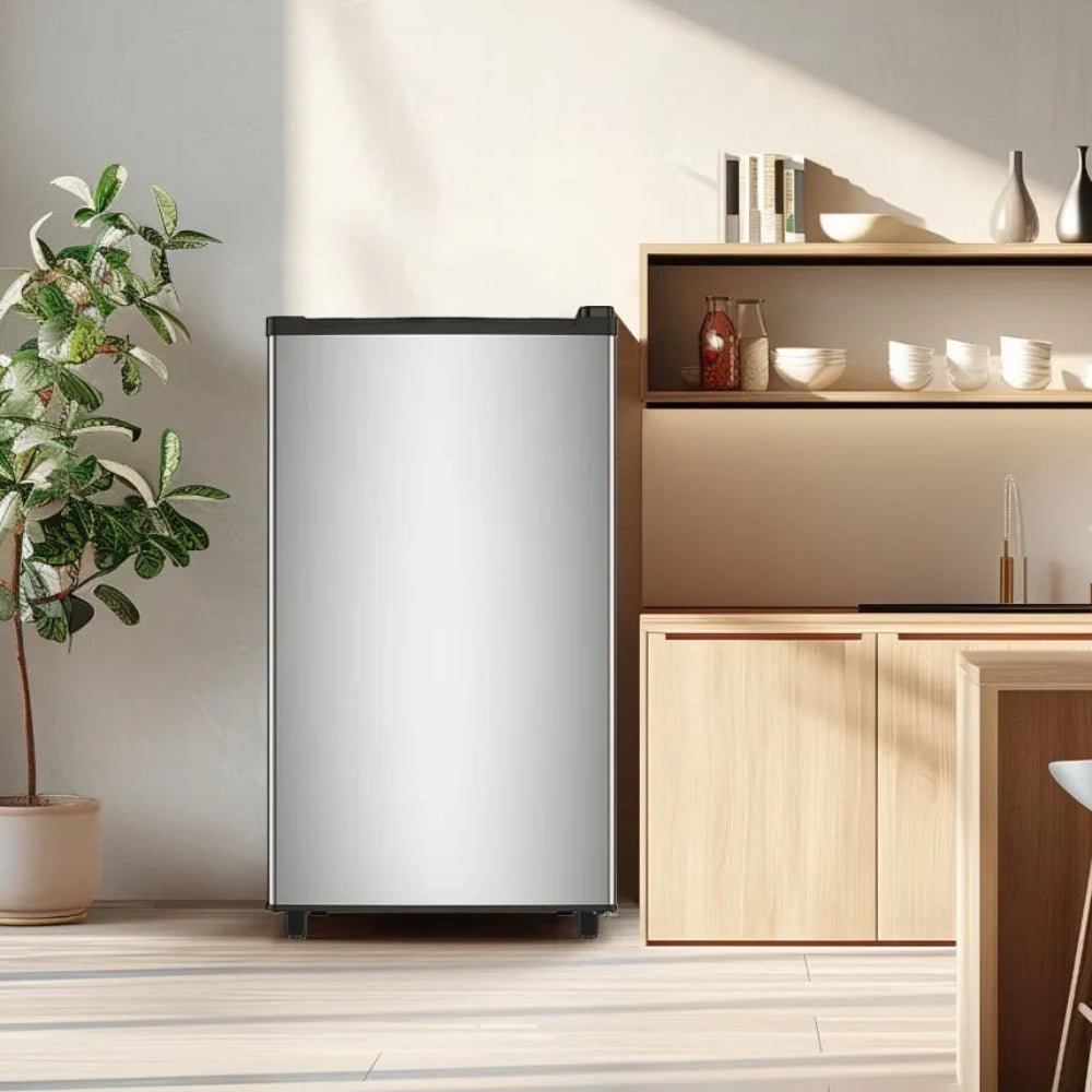 Mini fridge with freezer and adjustable temperature control, featuring a compact glass door design, perfect for bedrooms and offices. 0
