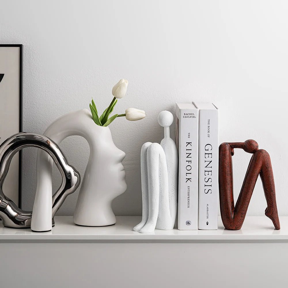 Minimalist bookshelf for small spaces featuring a durable steel and plastic design in brown and white colors, ideal for organizing books and decorative items. 4