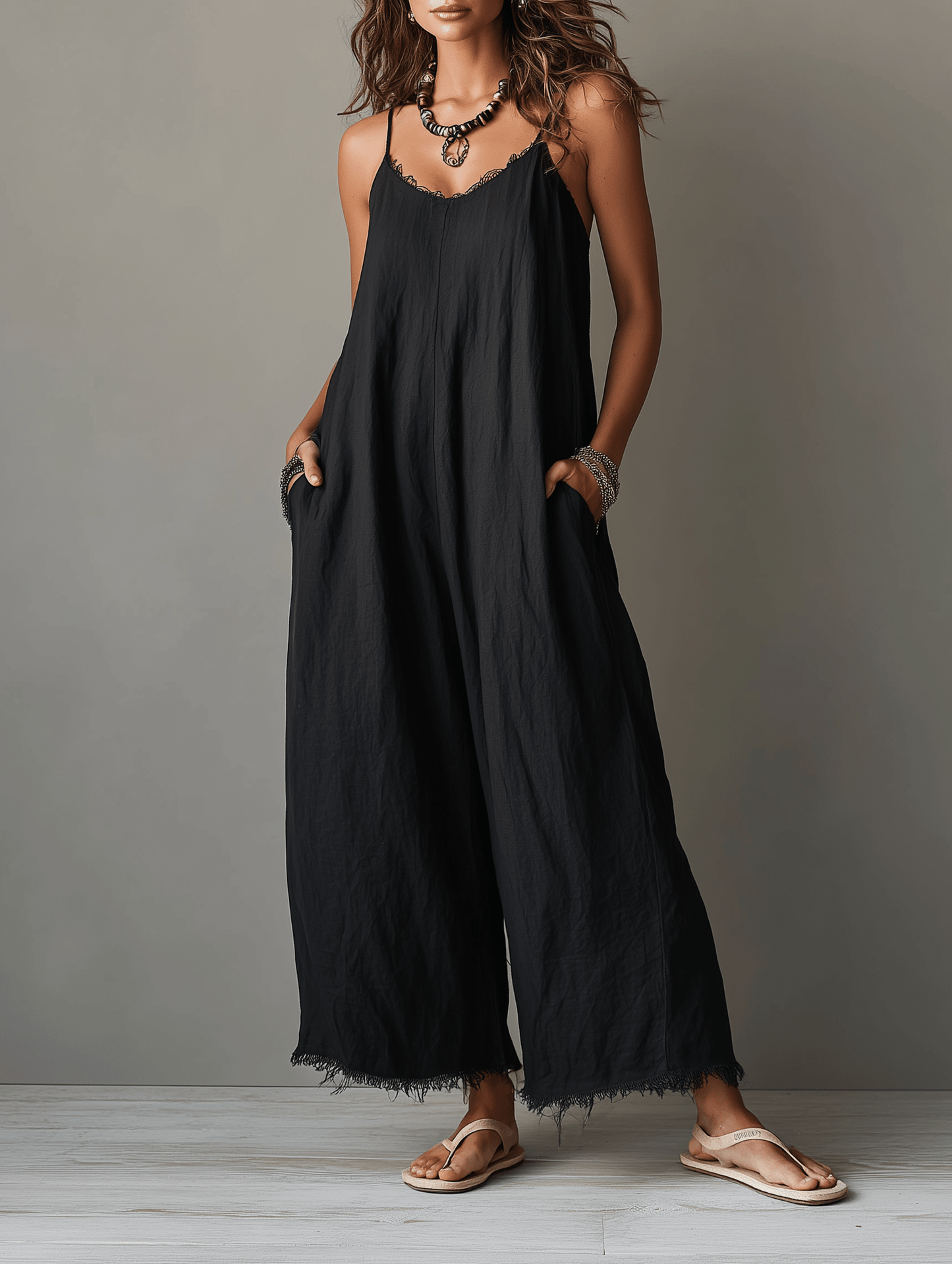 Minimalist jumpsuit for women featuring a lace neckline, adjustable straps, and a relaxed fit, crafted from soft breathable fabric for comfort and style. 0