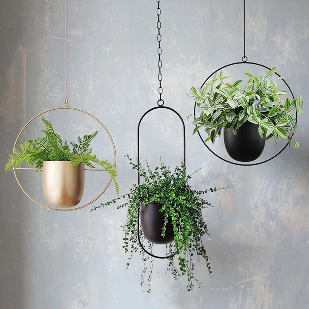 Minimalist plant hanger for hanging pots, featuring a modern metal design perfect for indoor use, showcasing versatility for various decor styles. 1