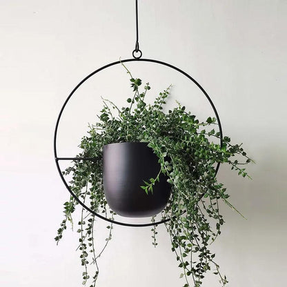 Minimalist plant hanger for hanging pots, featuring a modern metal design perfect for indoor use, showcasing versatility for various decor styles. 5