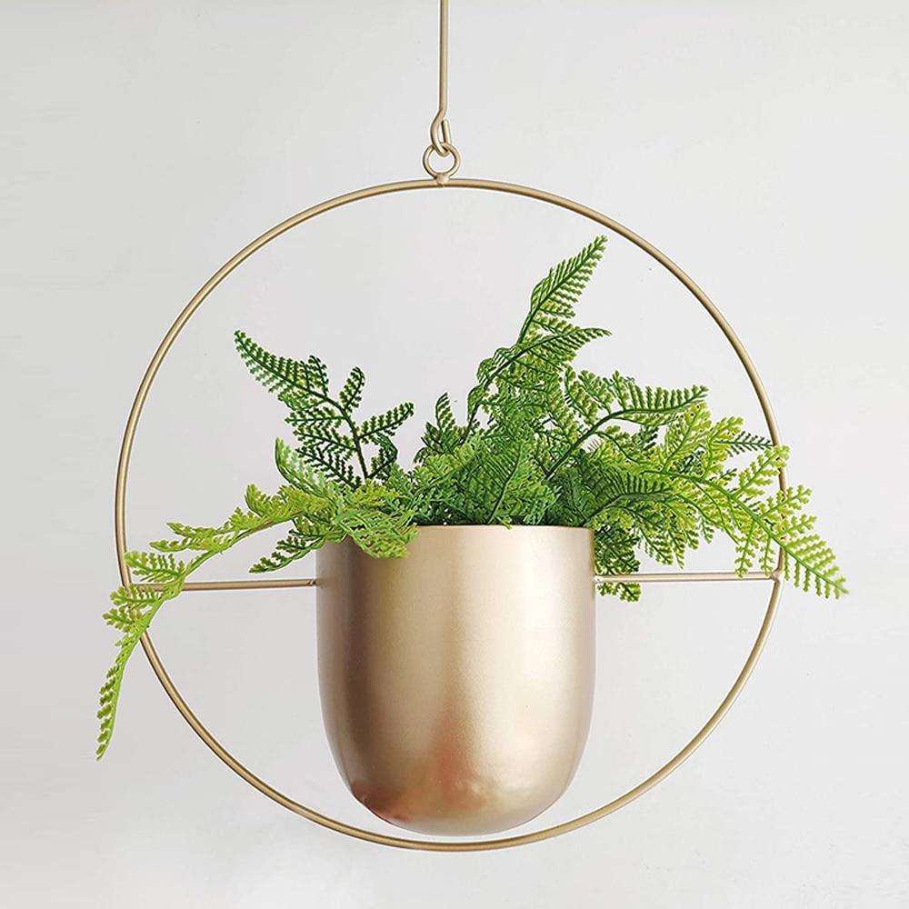 Minimalist plant hanger for hanging pots, featuring a modern metal design perfect for indoor use, showcasing versatility for various decor styles. 7
