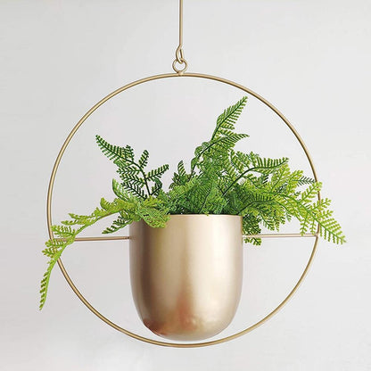 Minimalist plant hanger for hanging pots, featuring a modern metal design perfect for indoor use, showcasing versatility for various decor styles. 7