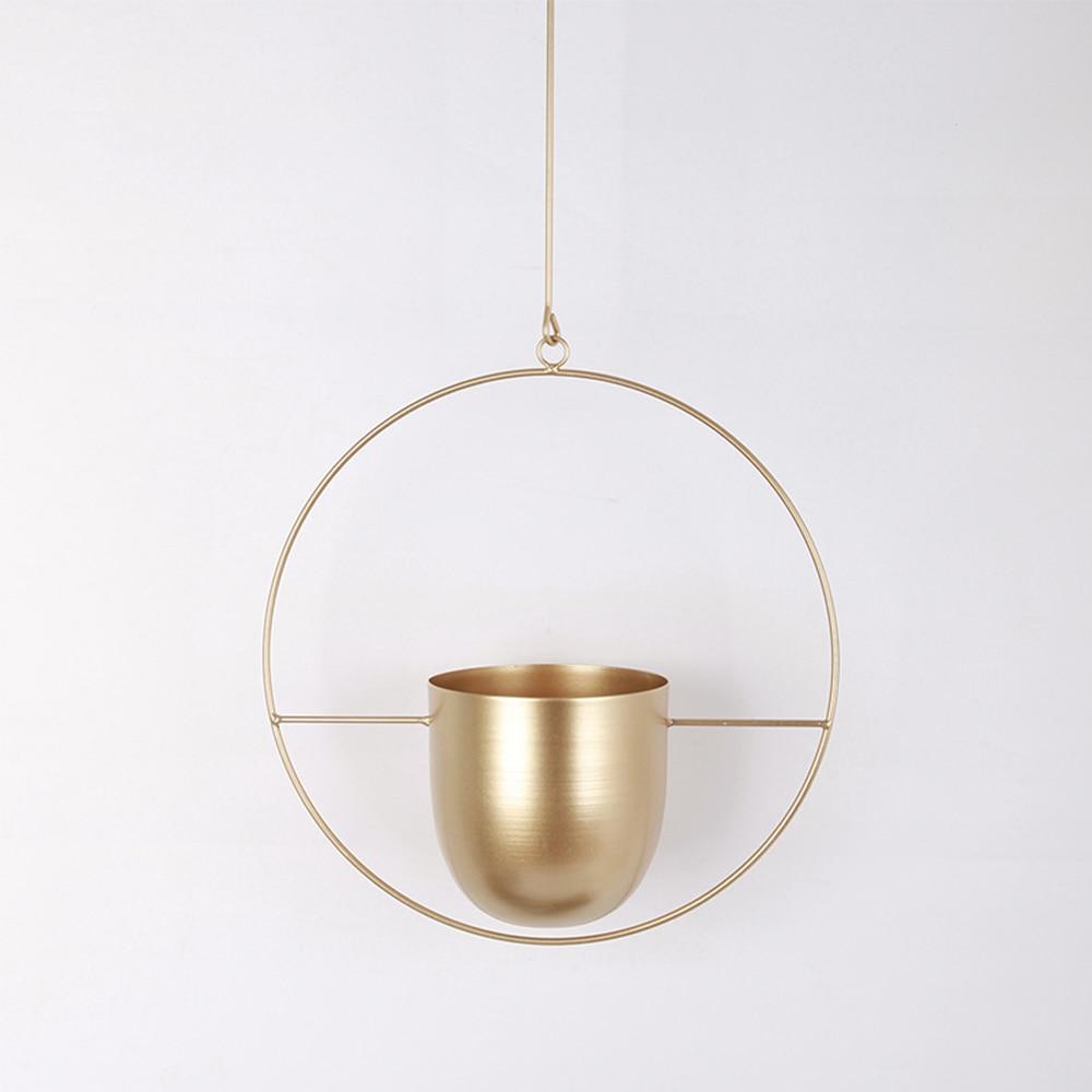 Minimalist plant hanger for hanging pots, featuring a modern metal design perfect for indoor use, showcasing versatility for various decor styles. 12