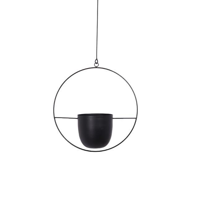 Minimalist plant hanger for hanging pots, featuring a modern metal design perfect for indoor use, showcasing versatility for various decor styles. 2
