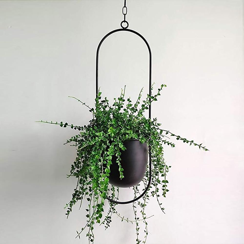 Minimalist plant hanger for hanging pots, featuring a modern metal design perfect for indoor use, showcasing versatility for various decor styles. 0