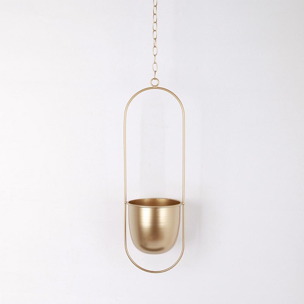Minimalist plant hanger for hanging pots, featuring a modern metal design perfect for indoor use, showcasing versatility for various decor styles. 10