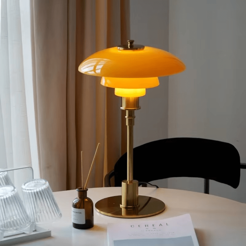 Minimalist table lamp featuring a warm LED light and elegant glass shade, ideal for bedside or desk use, with a sleek modern metal base. 2
