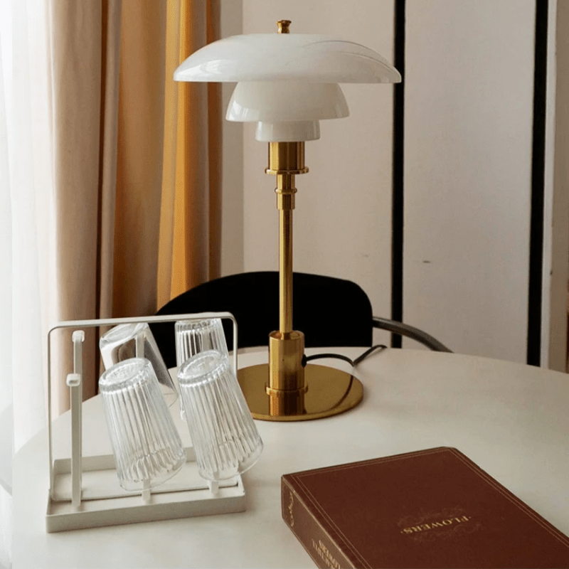 Minimalist table lamp featuring a warm LED light and elegant glass shade, ideal for bedside or desk use, with a sleek modern metal base. 8