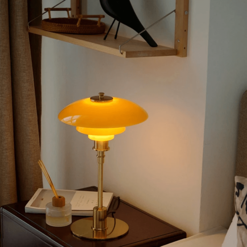 Minimalist table lamp featuring a warm LED light and elegant glass shade, ideal for bedside or desk use, with a sleek modern metal base. 5
