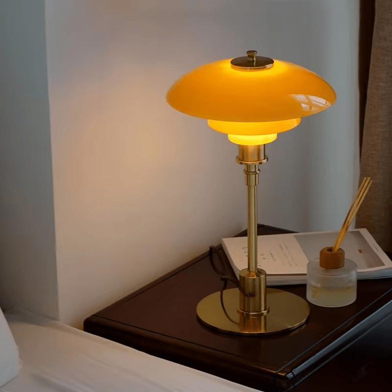 Minimalist table lamp featuring a warm LED light and elegant glass shade, ideal for bedside or desk use, with a sleek modern metal base. 3