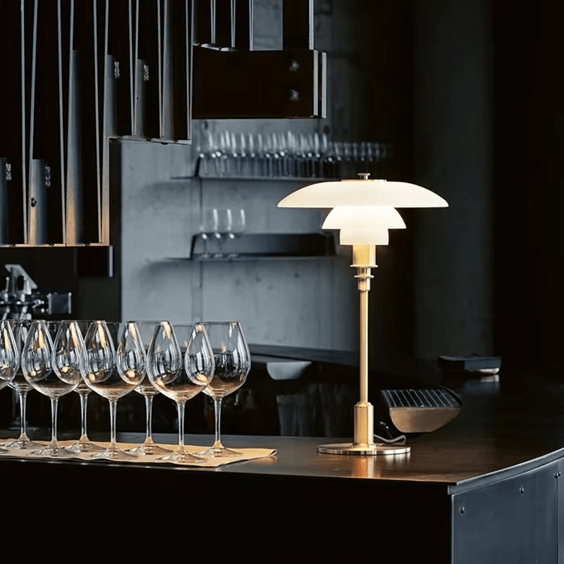 Minimalist table lamp featuring a warm LED light and elegant glass shade, ideal for bedside or desk use, with a sleek modern metal base. 6