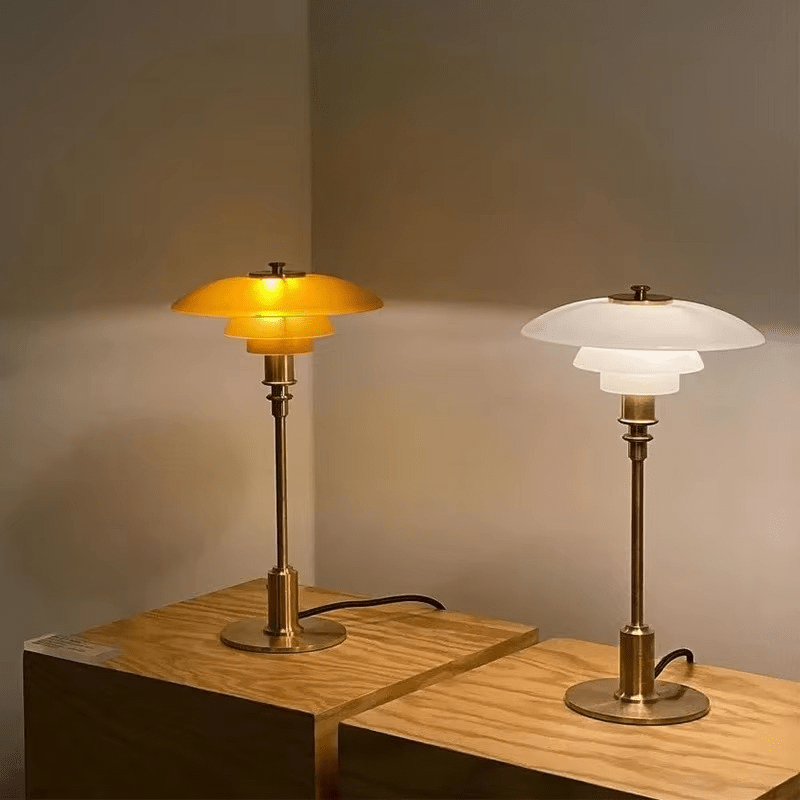 Minimalist table lamp featuring a warm LED light and elegant glass shade, ideal for bedside or desk use, with a sleek modern metal base. 4