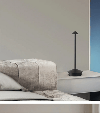 Minimalist wireless table lamp featuring a sleek design, dimmable LED functionality, and portability for indoor and outdoor use. 3