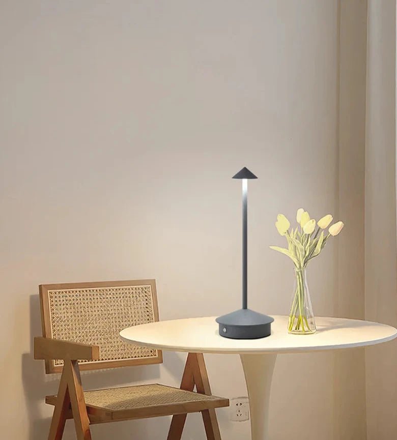 Minimalist wireless table lamp featuring a sleek design, dimmable LED functionality, and portability for indoor and outdoor use. 0