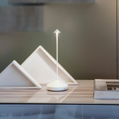 Minimalist wireless table lamp featuring a sleek design, dimmable LED functionality, and portability for indoor and outdoor use. 1