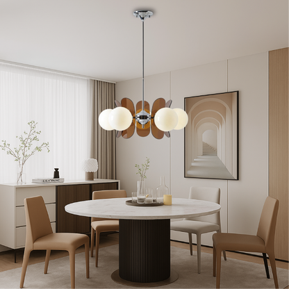 Modern chandelier light featuring an adjustable cable, showcasing a Bauhaus-inspired iron design complemented by elegant frosted glass spheres. 3